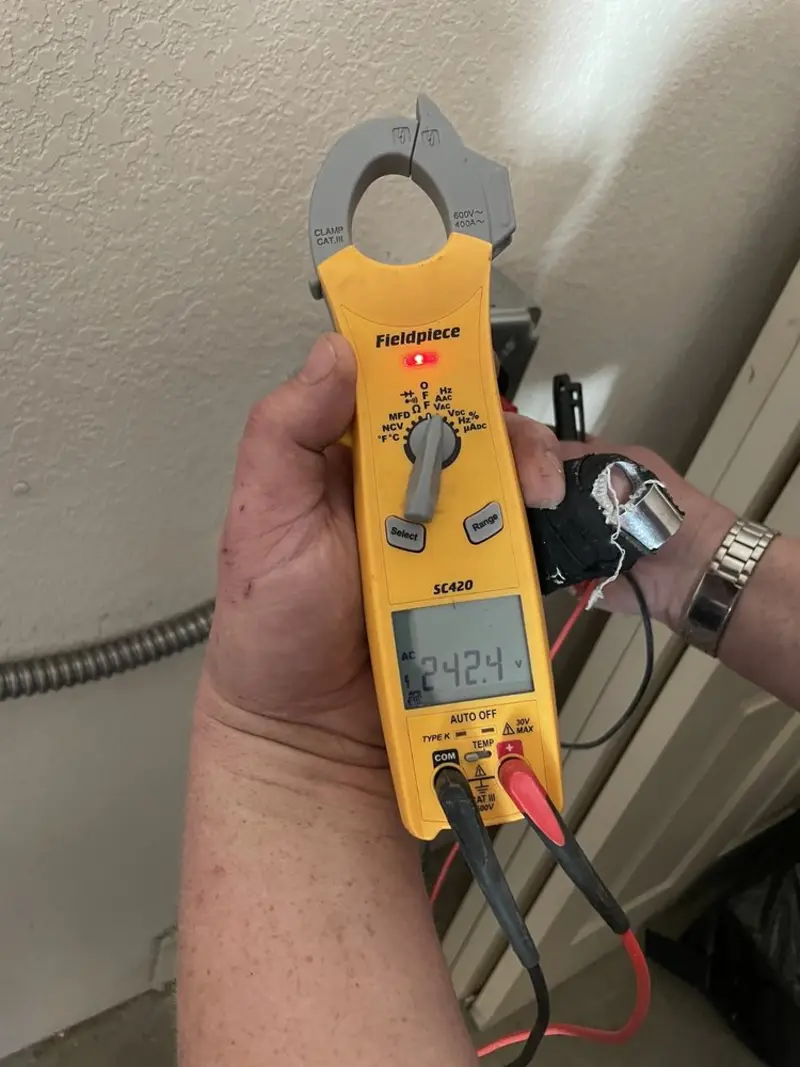 Voltage testing with clamp meter during Outlet Installation in Hartford